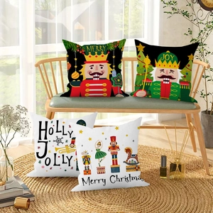 Close-up of Christmas nutcracker pillow covers with festive Merry and Joy patterns