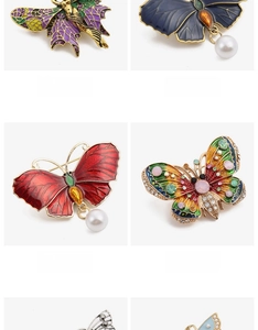 Detail view of four butterfly brooches with enamel, pearls, and rhinestones in styles 5-8