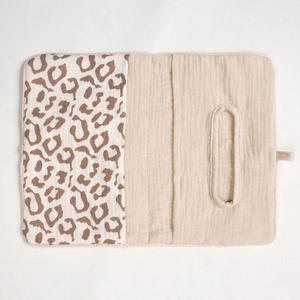 Detail of baby cotton crib organizer with leopard print and tissue dispenser pocket