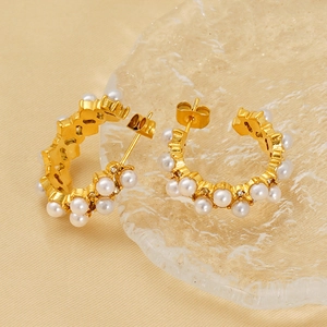 Elegant C-shaped gold hoop earrings with white pearls and sparkling zircons for women