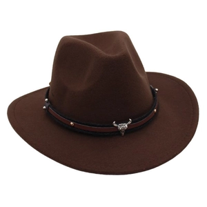 Detailed view of brown felt cowboy hat with gold studs and metal bull skull ornament