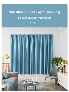 Detail of sky blue blackout curtain showing 100% light blocking and silky satin texture