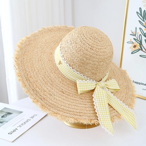 French woven raffia sun hat with wide brim and lace checkered ribbon for beach vacation