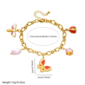 Detail of gold chain bracelet featuring enamel butterfly, ladybug and bee charms with sizes
