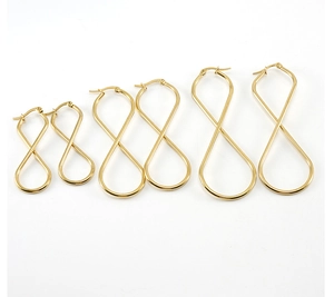 Three pairs of golden infinity shaped titanium steel earrings in graduated sizes