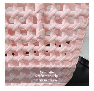 Close-up of the intricate hollow woven texture on a pink jelly basket tote bag