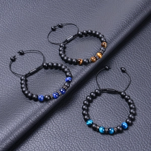 Three matte tiger eye stone bracelets with adjustable black braided rope on leather