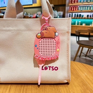 Pink Capybara magnetic drawing board keychain accessory on a canvas bag handle