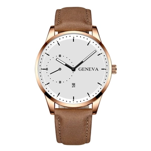 Detail of rose gold quartz watch featuring a white dial, date window, and brown leather strap