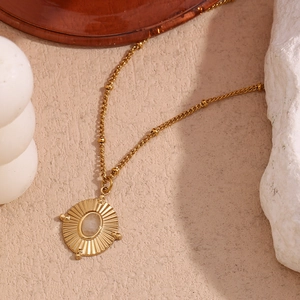 18K gold plated stainless steel necklace with radial textured natural crystal pendant