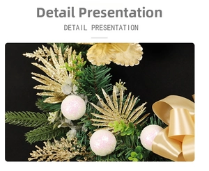 Detail of Christmas wreath with golden glitter ferns, pine needles and a satin bow