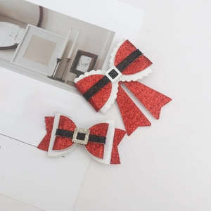 Red glitter Christmas bow hair clips with reindeer antler and snowflake accents for kids