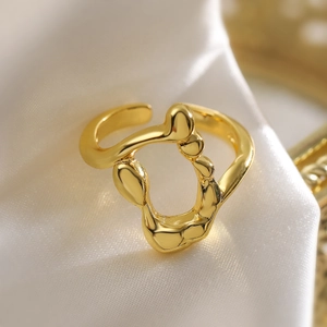 Minimalist 18K gold plated irregular geometric open ring on white silk fabric