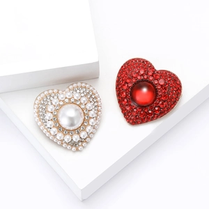 Elegant alloy heart brooches with pearls and rhinestones on white display stands