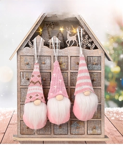 Three pink knitted faceless gnome Christmas ornaments with white hanging strings set