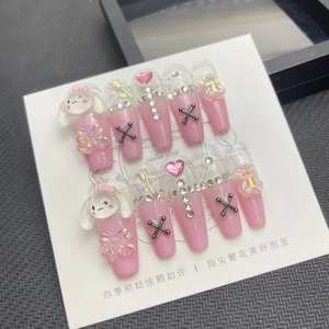 Detail of long coffin press-on nails featuring pink gradient, 3D bears, and bows