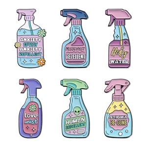 Set of 6 creative enamel pins shaped like spray bottles with alien and star illustrations