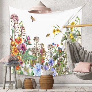 Detail of wildflower tapestry on wall with rustic home decor and hanging wood chair