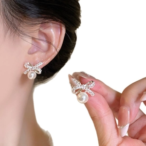 Elegant 18k gold plated bow earrings with sparkling rhinestones and white pearls