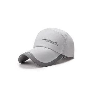 Detail of the quick-dry baseball cap with Modern British sports branding and side logo