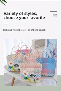 Detail of colorful woven picnic baskets with daisy floral and blue bow decorations