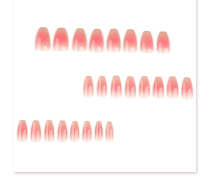 Flat lay of 24 pieces blush ombre press-on nails in short square shape with high gloss
