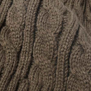 Brown cable-knit winter beanie with thick jacquard texture and warm fleece lining