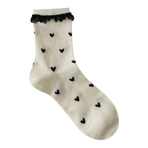 Women's cream mid-calf socks with black heart patterns and delicate lace trim detail