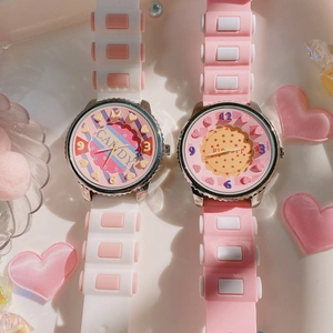 Close-up of candy and biscuit themed silicone children watches in pink and white colors