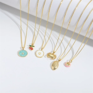 Fashionable ocean crab and assorted charm pendants on gold plated link chains