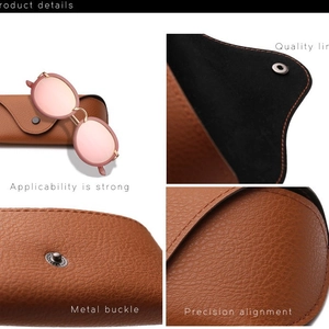 Occhiali da sole rosa con custodia in pelle marrone, fibbia in metallo e fodera di pregio