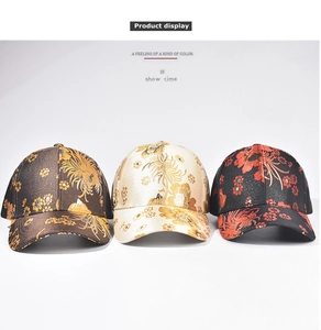 Detailed close-up of three baseball caps with traditional floral jacquard silk embroidery
