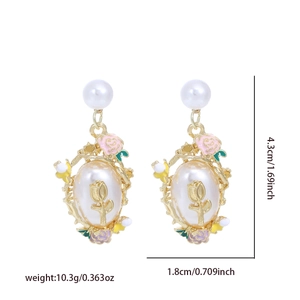 Detailed view of vintage floral pearl earrings with dimensions 4.3cm by 1.8cm