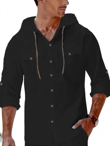 Detail of men's black linen hooded shirt with front chest pockets and roll-up sleeves