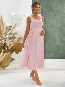 Detail of pink ribbed knit maternity dress with square neck and comfortable loose fit