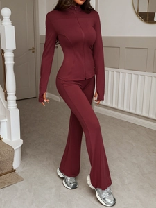Women Y2K burgundy sports tracksuit with slim zip-up top and high-waist flared pants