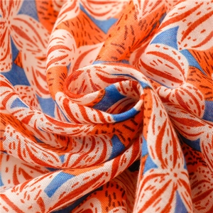 Detailed close-up of gardenia floral print fabric showing vibrant colors and soft texture
