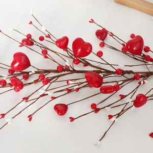 Macro shot of 60cm artificial Valentine vine with red foam hearts and decorative berries