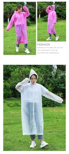 Detail of pink and white EVA long hooded raincoats with drawstrings and elastic cuffs