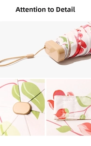 Close-up of pink floral umbrella showing handle strap, top cap, and velcro strap details