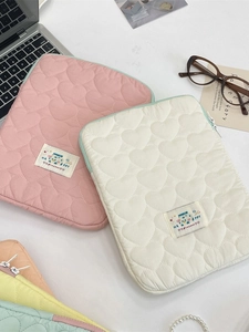 Quilted heart pattern iPad and laptop sleeve in soft pink and cream white padded fabric