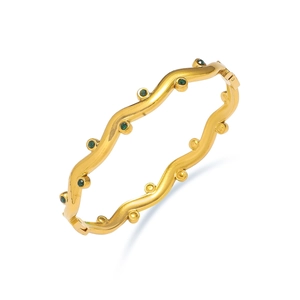 Elegant gold titanium steel wavy bangle with embedded green gemstones for women