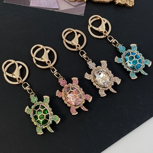 Colorful rhinestone turtle keychains in gold alloy, set of four vibrant colors