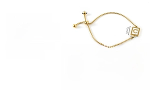 Detail of adjustable 18k gold plated shell pendant bracelet with letter C engraving