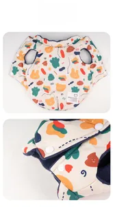 Detail of cartoon pet vest featuring snap buttons and warm dark blue fleece lining