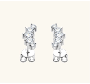 Macro shot of S925 sterling silver smile stud earrings with curved clear cubic zirconia