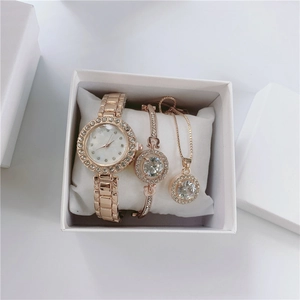 Macro detail of elegant rose gold watch set with crystal-encrusted bezel in a white gift box