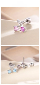 Macro view of cherry stud earrings with cubic zirconia and screw back fasteners