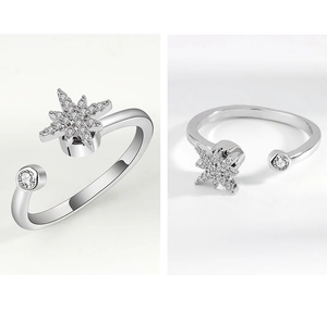Macro detail of rotating silver star ring with cubic zirconia on adjustable band
