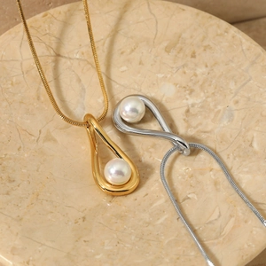 Elegant stainless steel snake chain necklace featuring a teardrop pearl pendant set